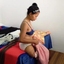 Shantal changing in the bedroom